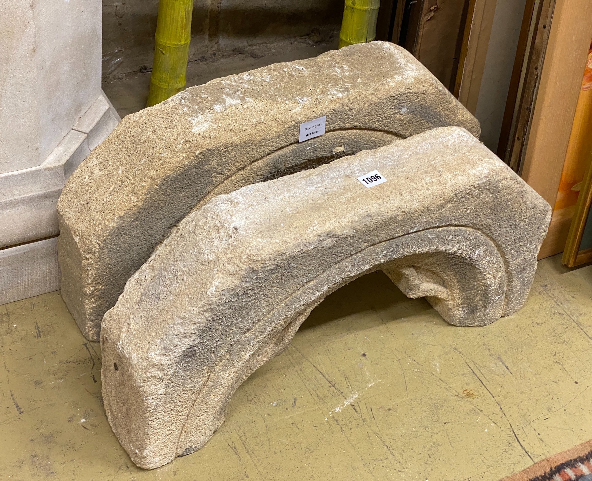 A pair of stone arches, width 64cm, height 31cm